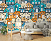 Colorful geometric house wall mural featuring vibrant blue, orange, and beige houses with minimalist trees, creating a modern and lively room atmosphere.