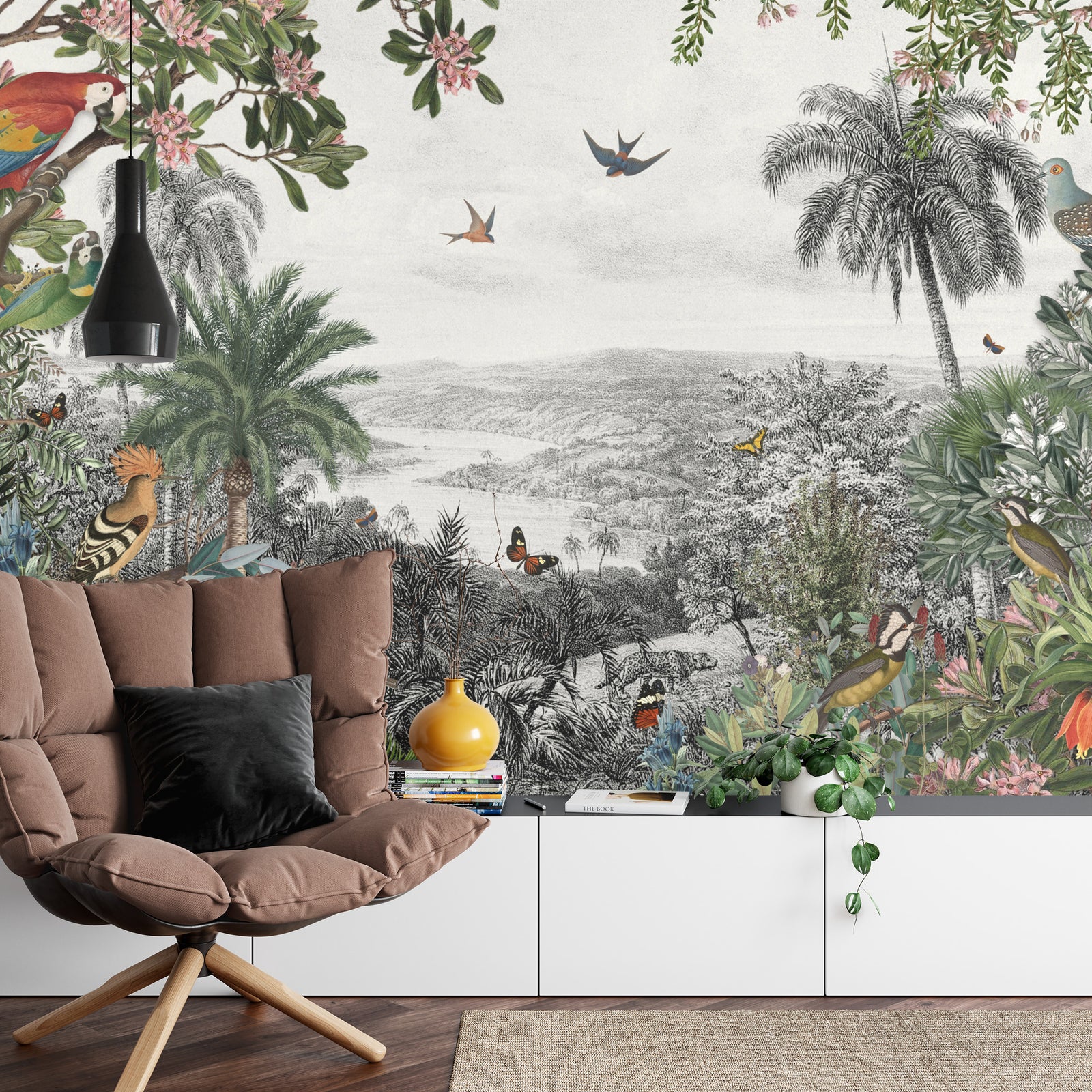 Vintage tropical wall mural with lush greenery, exotic birds, butterflies, and palm trees set against a black-and-white scenic landscape.