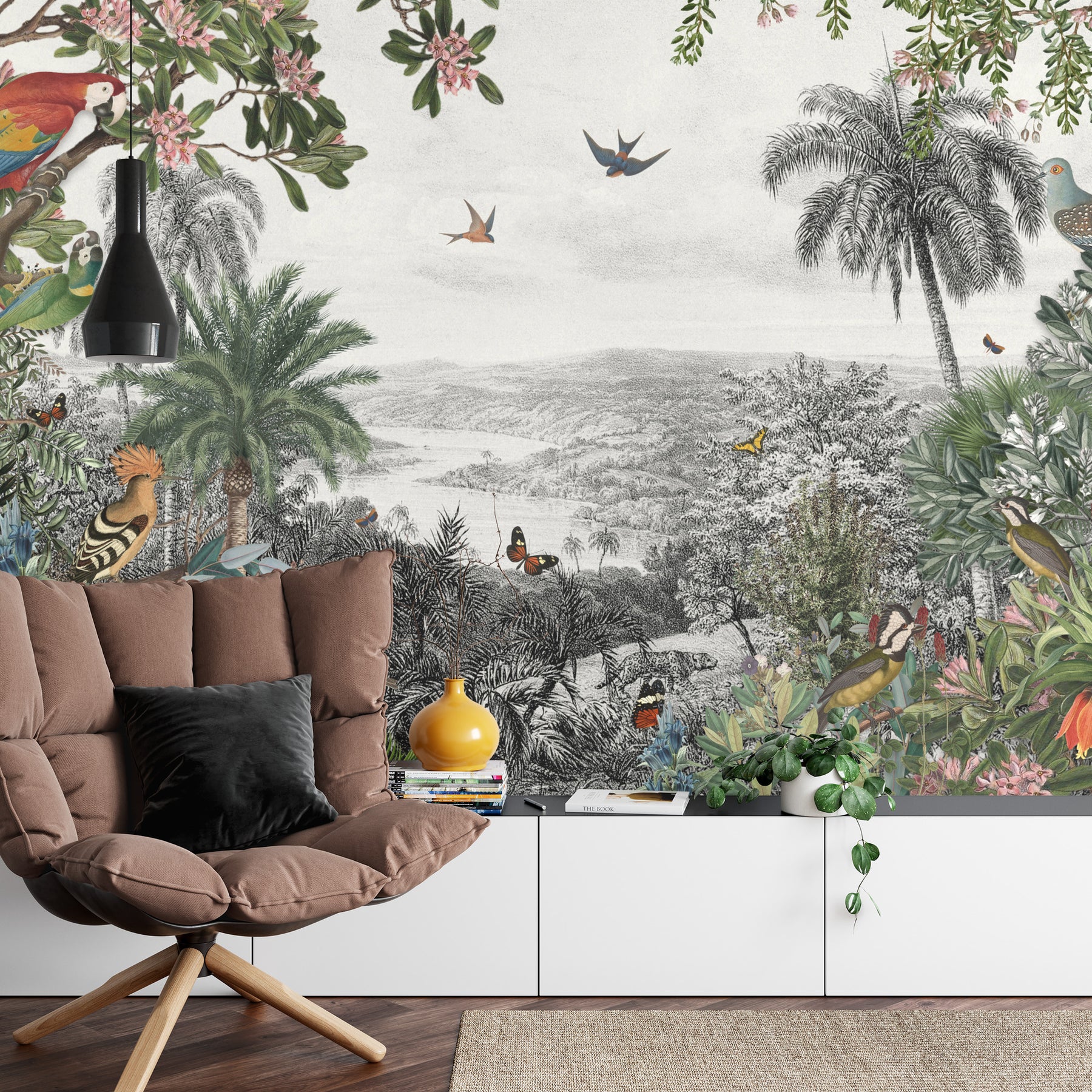 Vintage tropical wall mural with lush greenery, exotic birds, butterflies, and palm trees set against a black-and-white scenic landscape.