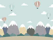 Scandinavian-style mountain nursery wallpaper with floating hot air balloons.