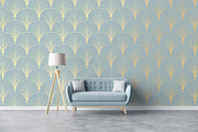 Sofa with a lamp against a wall with geometric patterned wallpaper