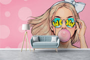 Trendy pop art wall mural featuring a stylish girl with sunglasses and bubble gum on a pink background.
