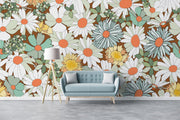 Floral wallpaper with a couch and lamp in front