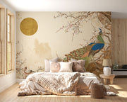 Peacock serenity wall mural with a detailed peacock, cherry blossoms, and golden sun on a beige background in a calm, elegant living room.