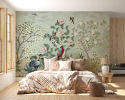 Hand-painted wall mural with exotic birds, lush green foliage, and delicate floral details, creating a tropical-inspired and sophisticated interior décor.