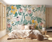 Charming  floral wall mural with pink, yellow, and green flowers in a cozy bohemian bedroom with natural wood decor.