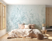 Soft blue palm leaf wall mural featuring oversized banana leaves on a light pastel background, perfect for modern interiors.