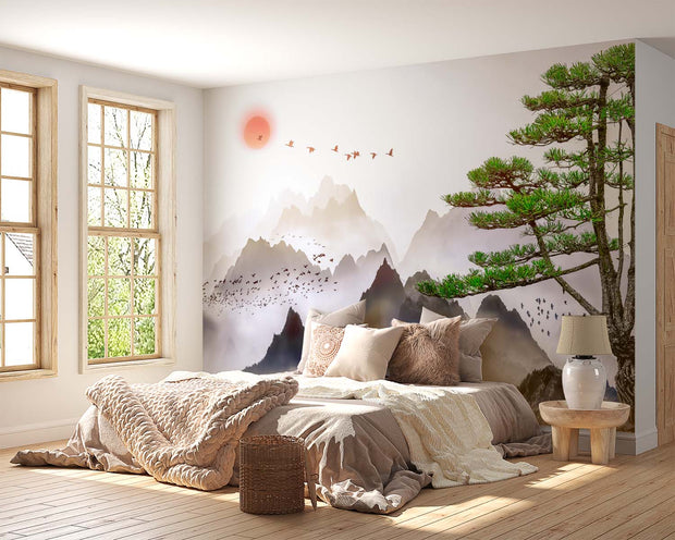 Minimalist Japanese mountain landscape wall mural with coral sunset and flying birds, styled in a modern bedroom.