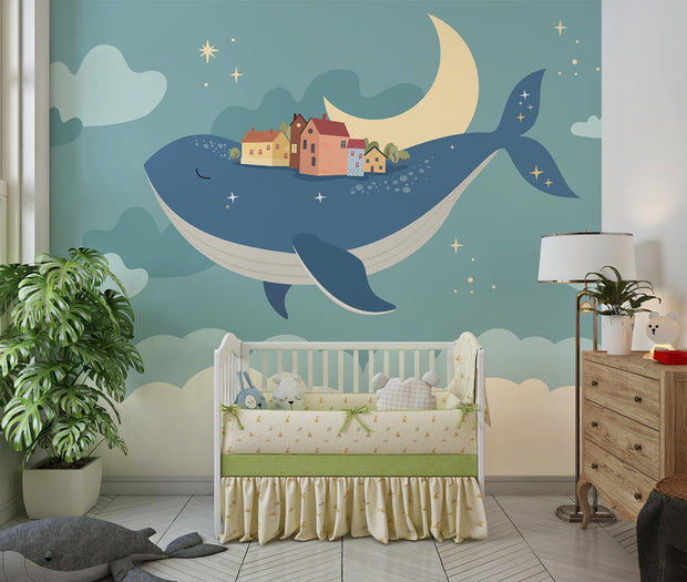 Whale and moon wall mural with a floating village, clouds, and a starry night sky, ideal for kids' rooms and nurseries.