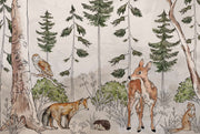 A charming woodland wall mural featuring a deer, fox, owl, and lush greenery surrounded by tall trees. Perfect for kid's rooms or nature-themed nurseries.