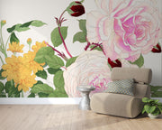Wall mural with vintage-style pink and white roses, yellow chrysanthemums, and green foliage decorating a living room.