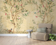 Elegant chinoiserie-style wall mural featuring delicate tree branches, blooming flowers, and colorful birds on a vintage beige background