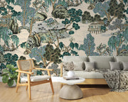 Detailed view of Chinoiserie mural showcasing hand-illustrated trees, pavilions, and serene water features in soft jade, taupe, and ivory tones; decorating a living room.
