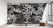 Black and white urban graffiti wall mural with bold typography, perfect for modern home or office decor.