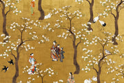 Japanese-inspired wall mural with white blossom trees, kimono-clad figures, cranes and rabbits on an ochre-gold background.