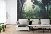 Rainforest jungle wall mural featuring dense greenery, tropical plants and sunlight streaming through the trees, creating a tranquil and vibrant ambiance.
