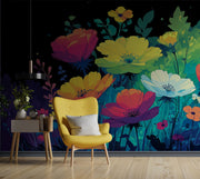 Yellow armchair in front of a vibrant floral wall mural with a dark background.