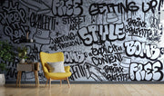 Graffiti wall mural with black-and-white street art typography and spray paint elements, ideal for urban-inspired bedrooms or creative spaces.
