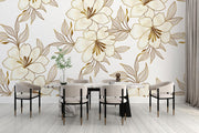 Elegant gold floral wall mural with oversized flowers and intricate leaves, featured in a modern dinning room.