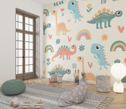 Playful dinosaur-themed wall mural with colorful cartoon dinosaurs, rainbows and flowers; decorating a cozy child’s playroom.