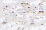 Whimsical world map wall mural featuring illustrated continents, animals, vintage aeroplanes, and hot air balloons.