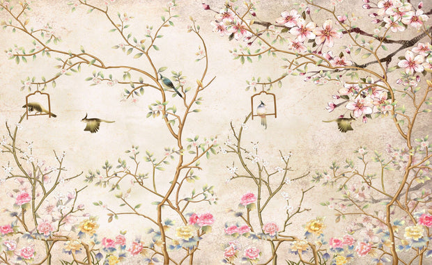Elegant bedroom interior featuring a pastel Chinoiserie wall mural with delicate cherry blossoms and birds, complemented by neutral boho bedding and soft lighting.