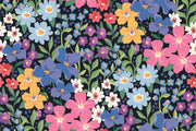 Colorful floral wall mural with hand-painted flowers in shades of blue, pink, yellow, and purple.