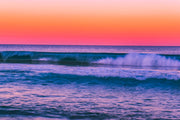 Tropical Ocean Sunset Wall Mural – Vibrant Seascape Wallpaper Featuring Rolling Waves, a Pink-Orange Twilight Sky, and a Relaxing Coastal Ambiance for Modern Interiors.