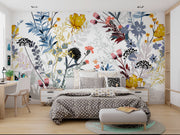 Modern bedroom with floral wallpaper and a bed with polka dot bedding.
