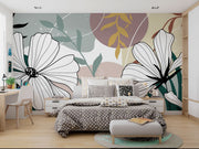 Modern bedroom with floral wall mural and polka dot bedding