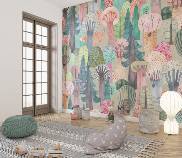 Room with colorful forest-themed wallpaper, bean bags, and a lamp.