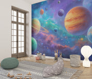 Children's room with a space-themed wall mural featuring planets and stars.