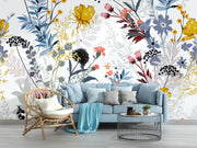Living room with floral wallpaper, blue sofa, and decorative items.