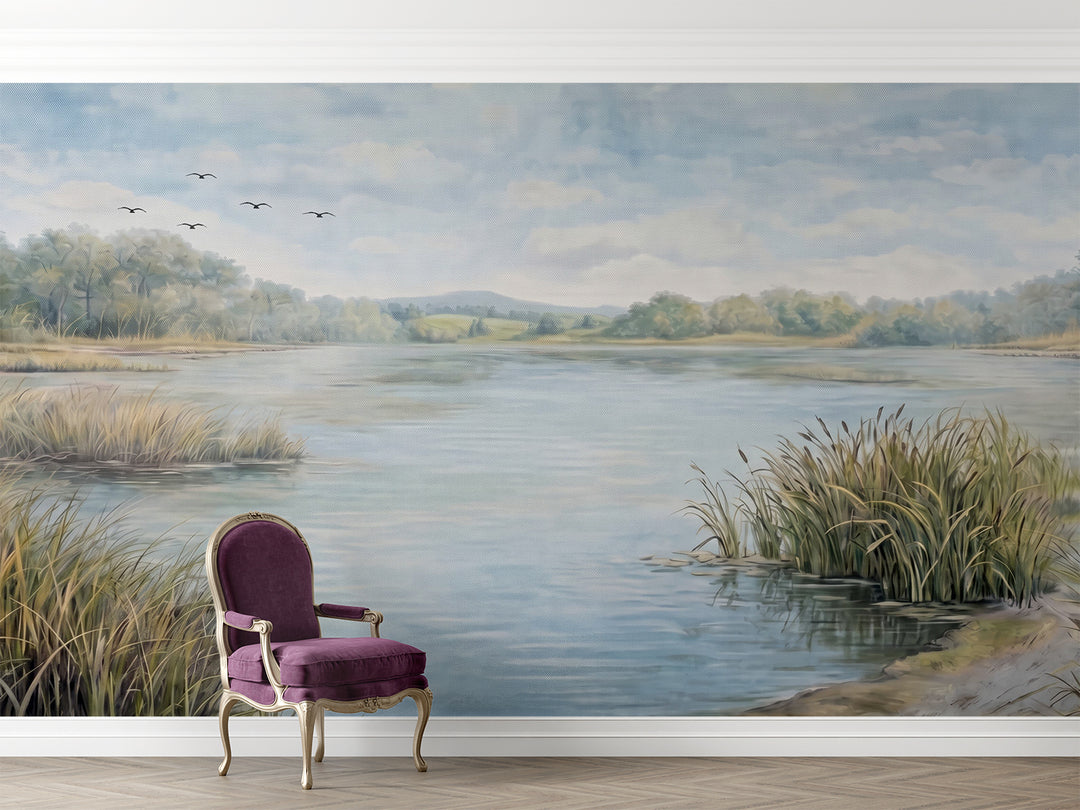 Painterly lake scenery mural in a formal sitting room with a velvet purple armchair.