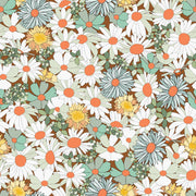 Pattern of flowers with white, green, and orange colors on a brown background