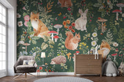 Enchanted forest animals wall mural with foxes, rabbits, hedgehogs, wildflowers, and mushrooms in a vintage botanical style, set against a deep green background.