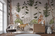 A charming woodland wall mural featuring a deer, fox, owl, and lush greenery surrounded by tall trees. Perfect for kid's rooms or nature-themed nurseries.