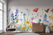 Watercolor wildflower wall mural featuring hand-painted flowers in vibrant colors with butterflies, styled in a playful children’s room with a white teepee.