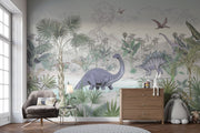 Jungle dinosaur wall mural and wallpaper featuring Stegosaurus, Brontosaurus, lush jungle plants and volcanoes; styled in a playful kid's room.