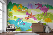 A playful dinosaur wall mural with bright cartoon-style dinosaurs, a volcano, greenery, and prehistoric elements in a kids' room.


