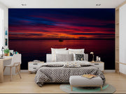 Sunset Over the Ocean Wall Mural – Stunning Seascape Wallpaper Featuring a Sailboat Silhouette, Deep Twilight Sky, and Serene Ocean Waters for Relaxing Interiors.