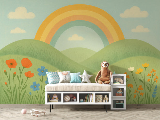Whimsical rainbow and flower wall mural behind a soft bench with plush toys in a kids’ room.