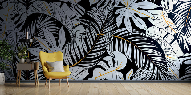Black and white tropical leaf wall mural with gold accents, featuring monstera and palm leaves in a modern botanical design.