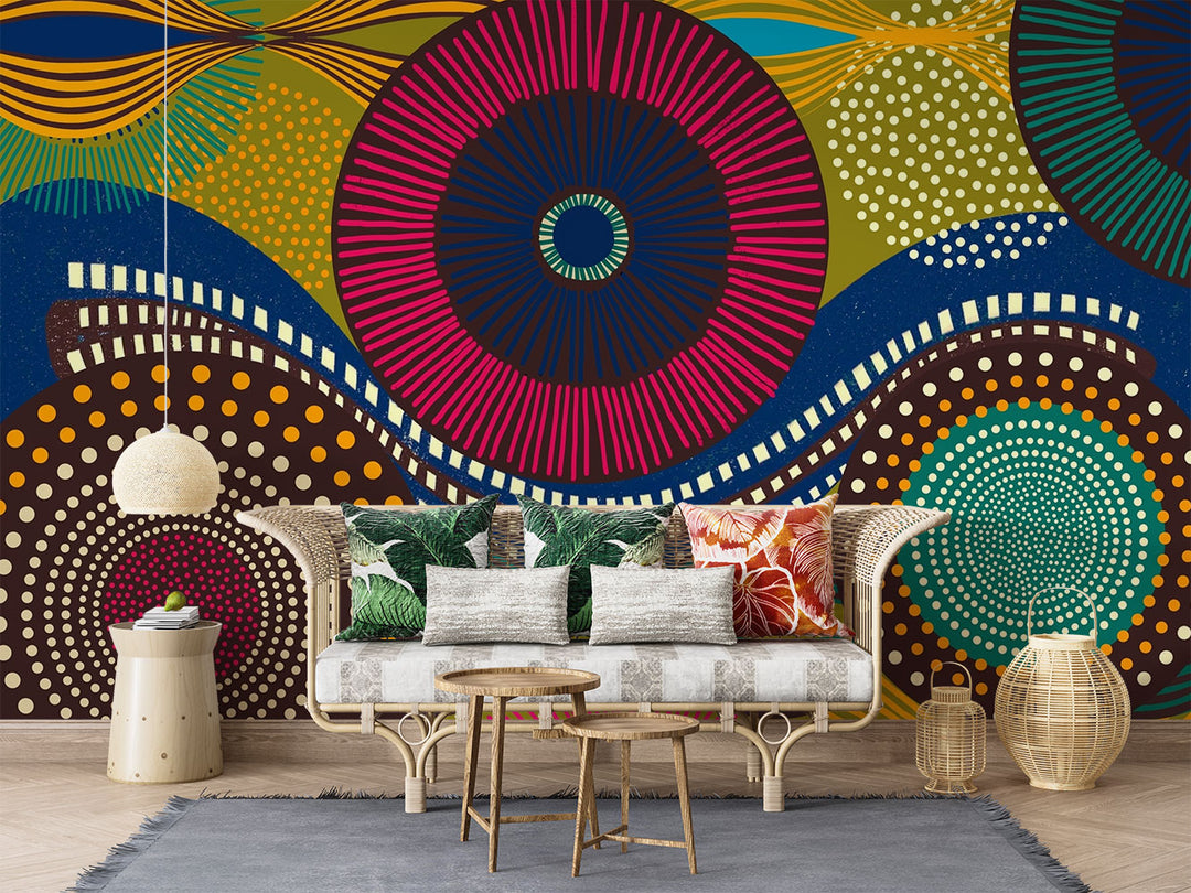 Vibrant abstract wall mural with bold geometric circular patterns, featuring bright colors and dynamic designs for modern interior decor. Styled in a living room with a sofa.