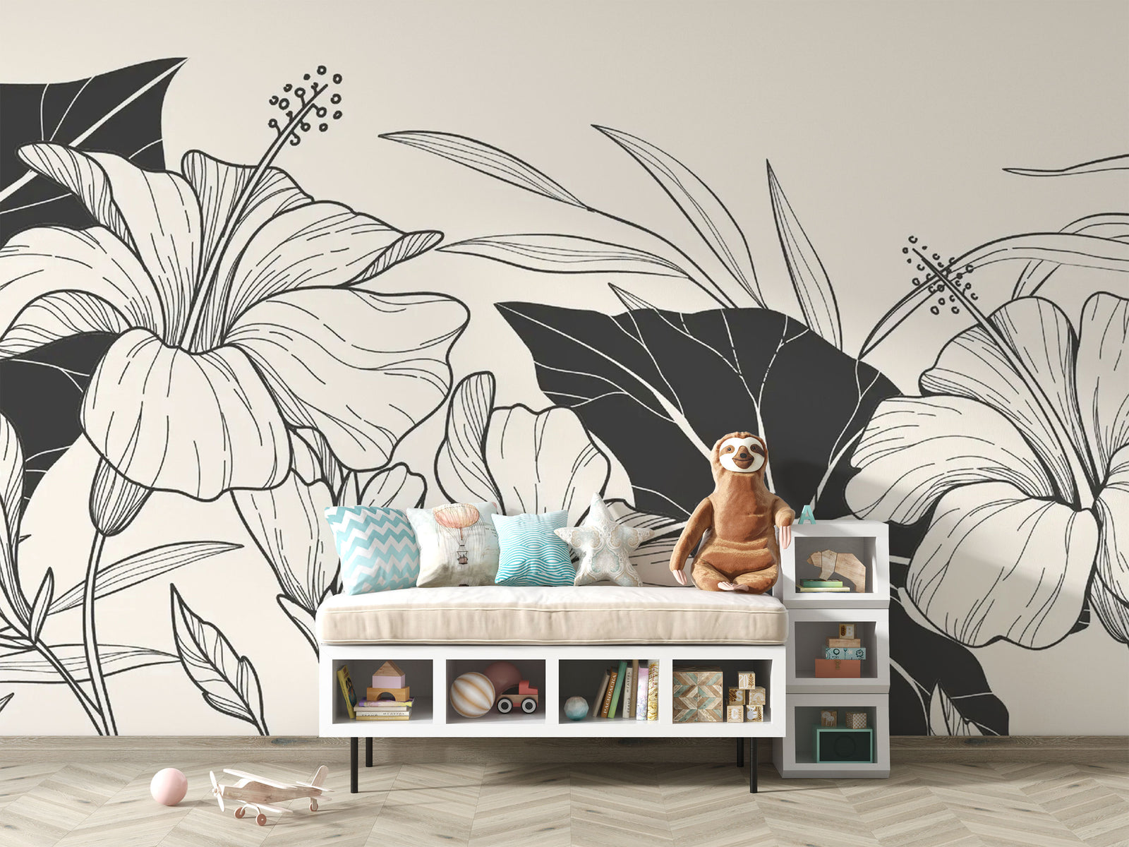 Children’s room with toys and a bench set against a monochrome botanical wallpaper with floral line illustrations.


