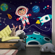 Navy Cartoon Astronaut and Rocket Wall Mural – child’s room with yellow cushions mock-up