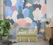 Pastel Woodland Trees and Mountains Wall Mural – nursery with a cot mock-up