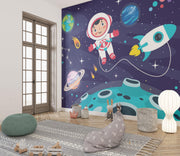 Navy Cartoon Astronaut and Rocket Wall Mural – playroom with floor cushions mock-up