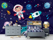 Navy Cartoon Astronaut and Rocket Wall Mural – child’s bedroom with blue checked bedding mock-up