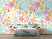 Pastel Watercolour Flower Pattern Wall Mural – bedroom with a pale bed and colourful cushions mock-up
